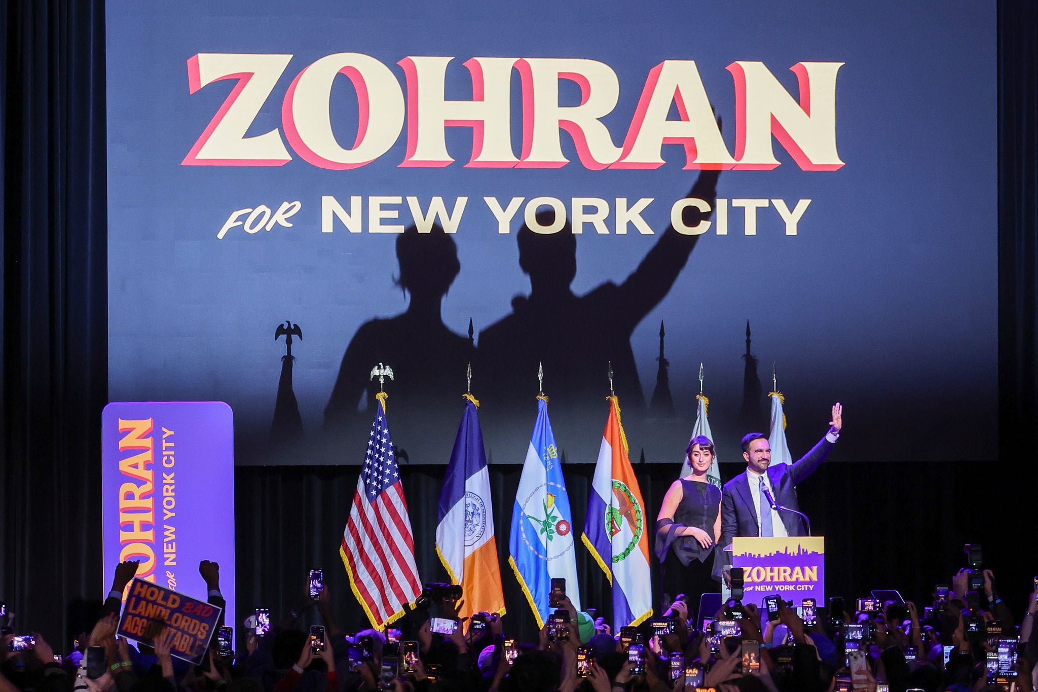 NEW YORK (United States), 05/11/2025.- Mayor-elect of New York City Zohran Mamdani (L) and his spouse Rama Duwaji (R) wave to the crowd during an election night party hosted by the Democratic nominee in the Brooklyn borough of New York, USA, 04 November 2025. Mamdani has defeated Andrew Cuomo to win the New York mayoral election. (Nueva York) EFE/EPA/SARAH YENESEL
